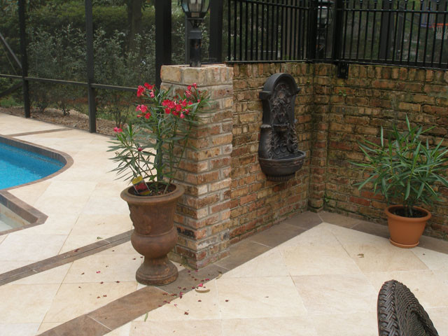 This is an example of a traditional backyard patio in Miami with decking and no cover.