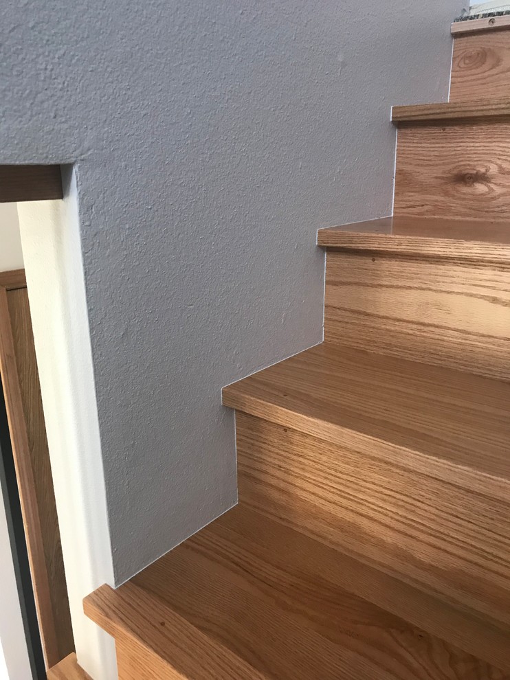 Inspiration for a mid-sized midcentury wood l-shaped staircase in Portland with wood risers and mixed railing.