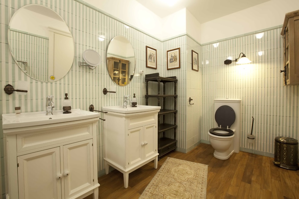 Traditional master bathroom in Other with raised-panel cabinets, beige cabinets, a one-piece toilet, multi-coloured tile, ceramic tile and dark hardwood floors.