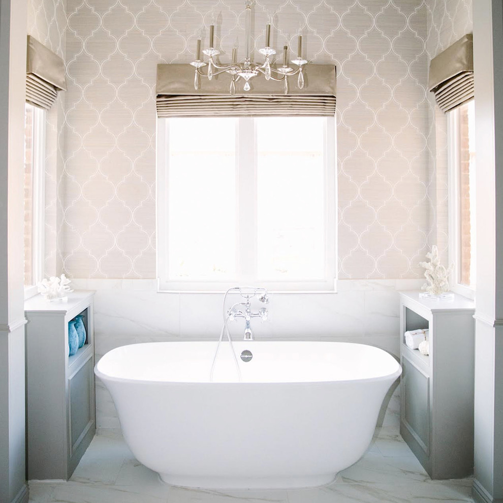 Inspiration for a mid-sized contemporary master bathroom with open cabinets, white cabinets, a freestanding tub, gray tile, marble floors and grey walls.