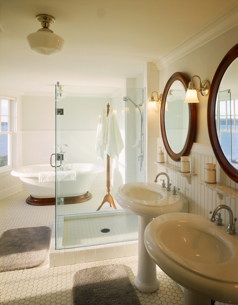 Inspiration for a large traditional master bathroom in Portland Maine with a freestanding tub, an alcove shower, white walls, ceramic floors, a pedestal sink, white floor and a hinged shower door.