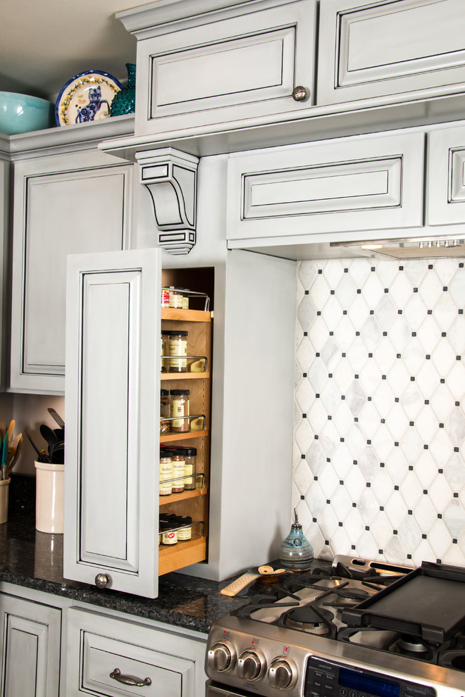 Eat-in kitchen - large transitional u-shaped porcelain tile and beige floor eat-in kitchen idea in Milwaukee with an undermount sink, raised-panel cabinets, gray cabinets, granite countertops, white backsplash, marble backsplash, stainless steel appliances and no island
