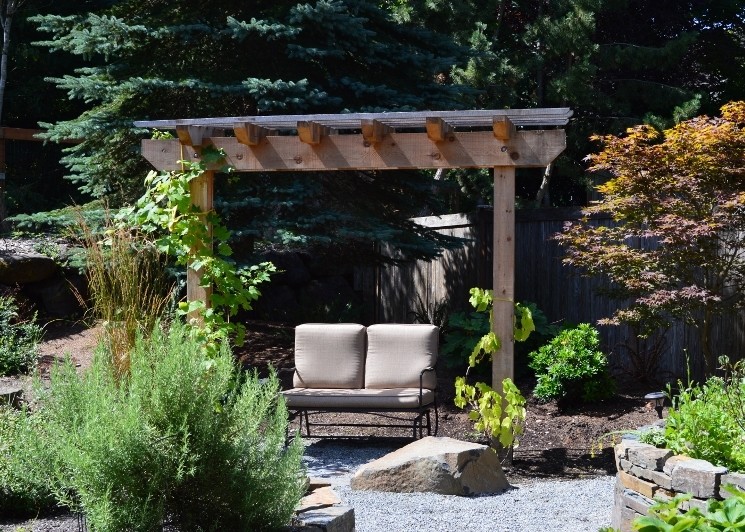This is an example of a mid-sized eclectic backyard full sun garden in Seattle with a vegetable garden and gravel.