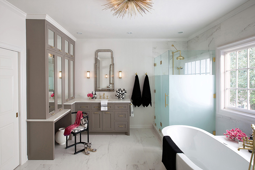 Mid-sized transitional master white tile, gray tile and stone tile marble floor freestanding bathtub photo in Houston with shaker cabinets, white walls, beige cabinets, an integrated sink and solid surface countertops