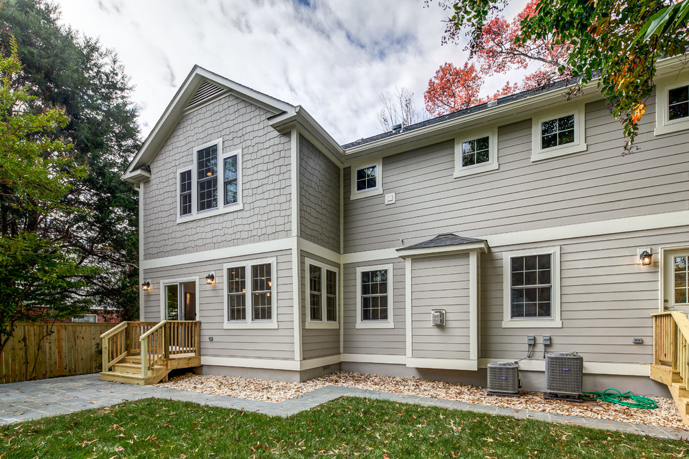 Inspiration for a transitional gray two-story wood gable roof remodel in DC Metro