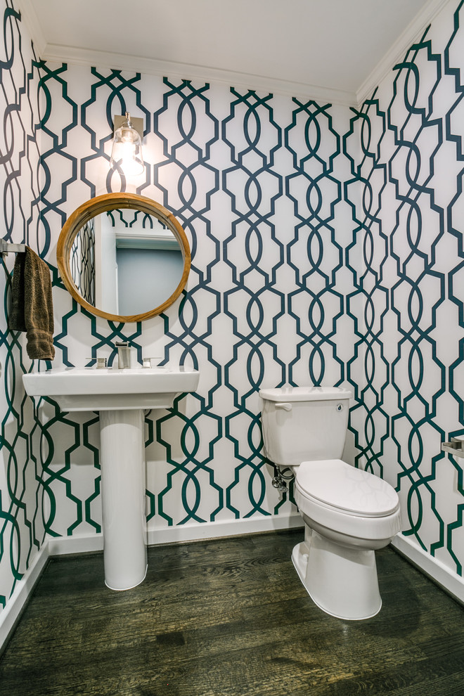 Inspiration for a small transitional dark wood floor powder room remodel in Dallas with a two-piece toilet, multicolored walls and a pedestal sink