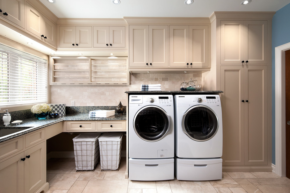 Inspiration for a large traditional l-shaped dedicated laundry room in Toronto with beige cabinets, beige walls, a side-by-side washer and dryer, an undermount sink and recessed-panel cabinets.