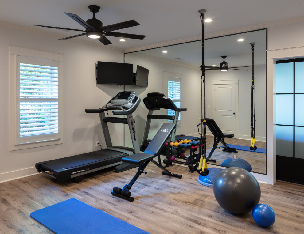 Inspiration for a mid-sized transitional multipurpose gym in Atlanta with grey walls, vinyl floors and brown floor.