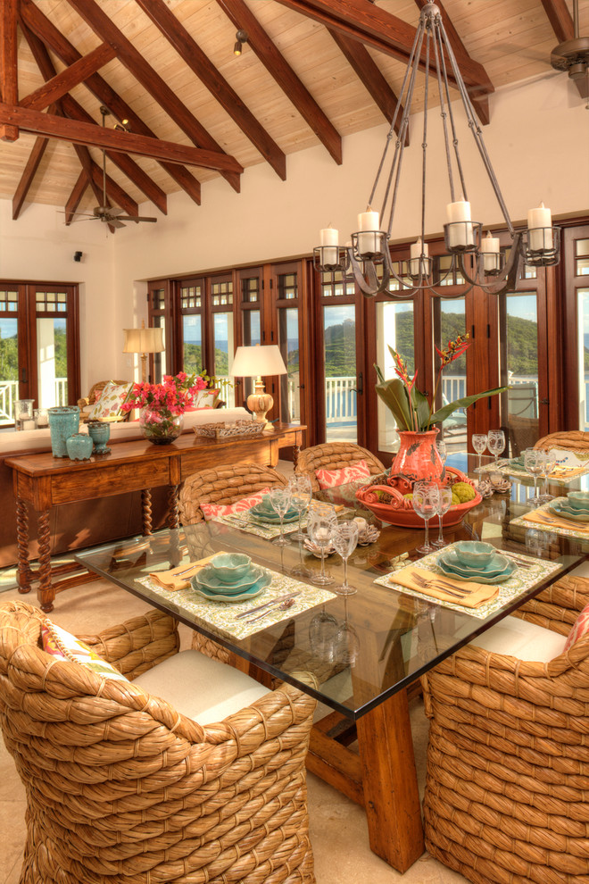 This is an example of a tropical dining room in Other.