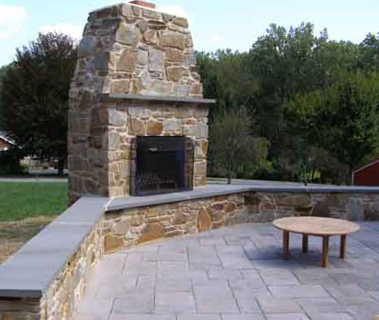 Inspiration for a mid-sized rustic backyard deck remodel in Baltimore with no cover and a fire pit