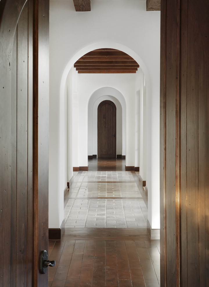 This is an example of a mediterranean hallway in Phoenix with white walls.