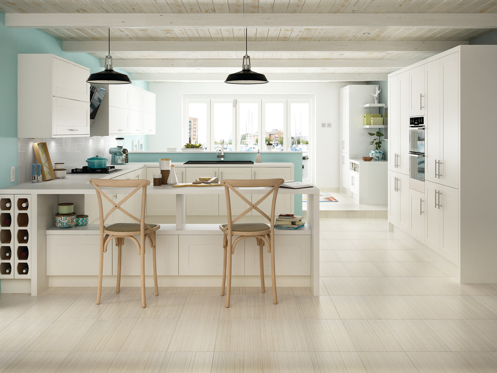 Inspiration for a contemporary u-shaped eat-in kitchen remodel with porcelain backsplash