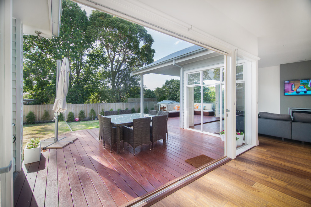 Photo of a large contemporary backyard deck in Melbourne.