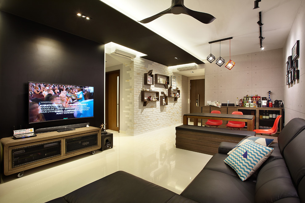 Photo of a contemporary family room in Singapore with black walls, no fireplace, a wall-mounted tv and white floor.