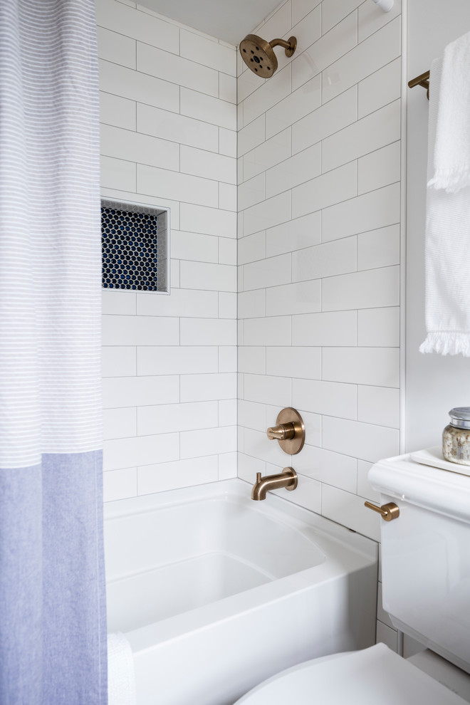 Inspiration for a small scandinavian master bathroom in Seattle with shaker cabinets, blue cabinets, an alcove tub, a shower/bathtub combo, a two-piece toilet, white walls, cement tiles, an undermount sink, engineered quartz benchtops, multi-coloured floor, a shower curtain, white tile and ceramic tile.