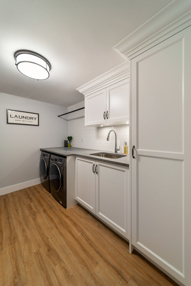 Inspiration for a transitional laundry room remodel in Vancouver