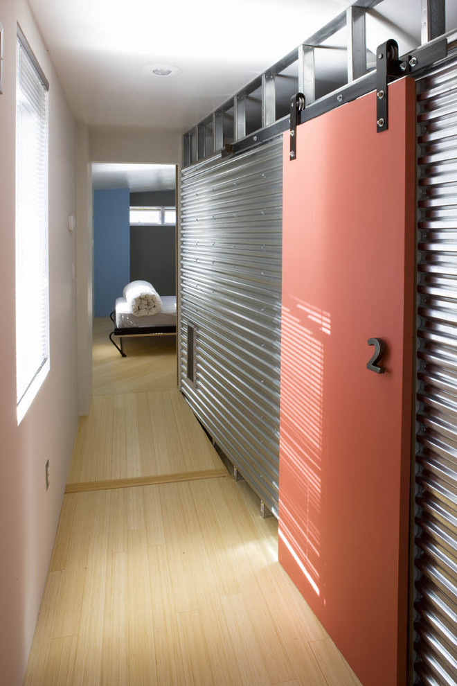 This is an example of an industrial hallway in DC Metro with white walls and light hardwood floors.