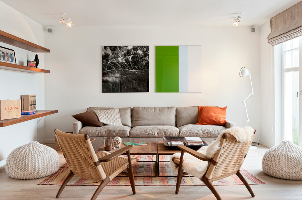 Inspiration for a scandinavian light wood floor living room remodel with white walls, no fireplace and no tv