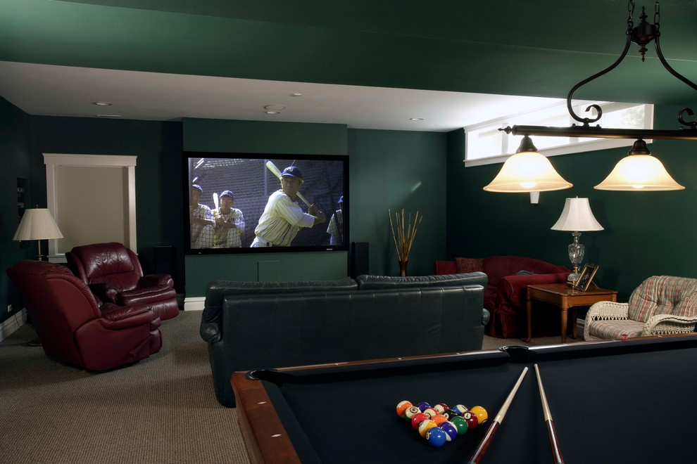 Inspiration for a large traditional look-out basement in Chicago with green walls and carpet.