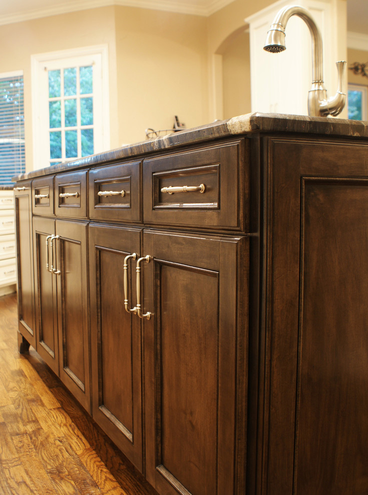 Transitional medium tone wood floor home design photo in Dallas with an undermount sink, flat-panel cabinets, gray cabinets, granite countertops, beige backsplash, stainless steel appliances, beige walls and an island