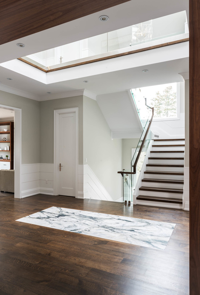 Inspiration for a large contemporary hallway in Toronto with grey walls and dark hardwood floors.