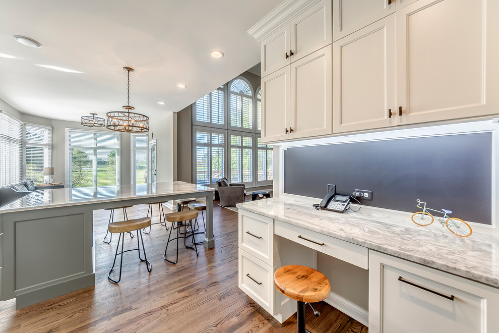 Transitional open concept kitchen photo in Chicago with white backsplash, subway tile backsplash and two islands