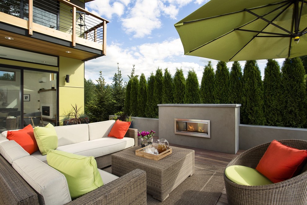 Inspiration for a contemporary deck remodel in Seattle with a fireplace
