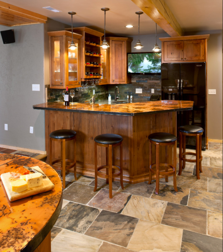 Design ideas for a mid-sized country u-shaped wet bar in Other with an undermount sink, shaker cabinets, medium wood cabinets, granite benchtops and stone tile splashback.