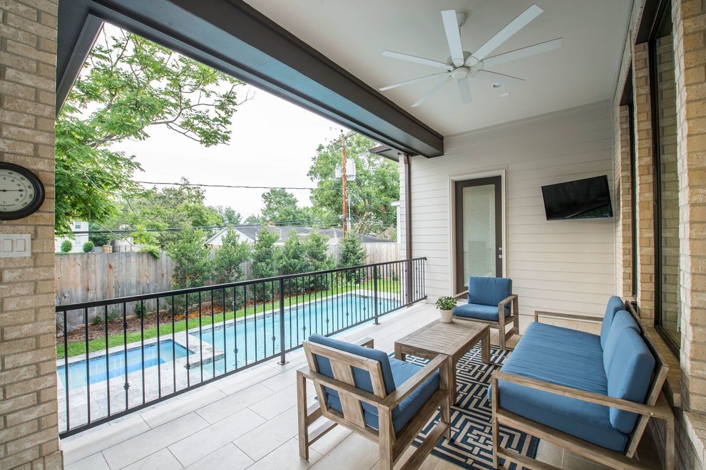 Deck - transitional backyard deck idea in Houston with a roof extension