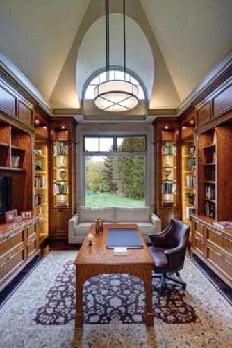 Photo of a mid-sized transitional study room in Detroit with dark hardwood floors and a freestanding desk.