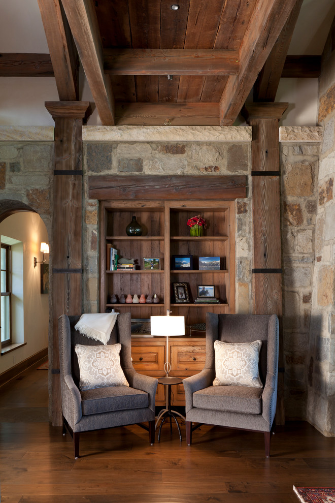 Example of a large transitional medium tone wood floor foyer design with gray walls