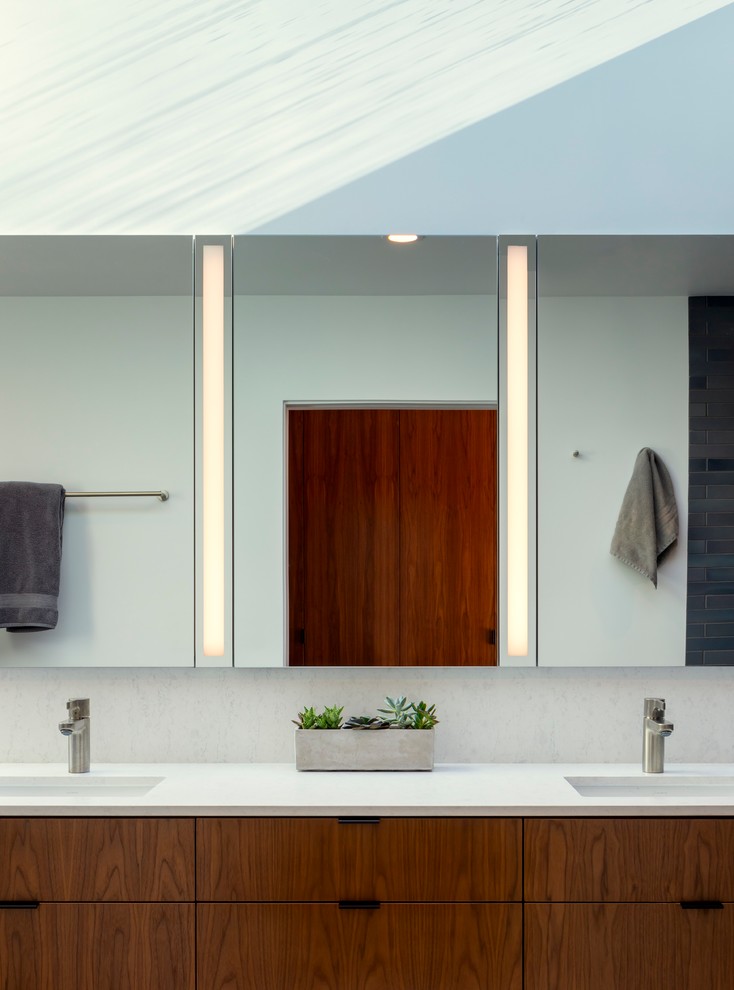 Photo of a large modern master bathroom in San Francisco with flat-panel cabinets, medium wood cabinets, a curbless shower, porcelain tile, porcelain floors, an undermount sink, engineered quartz benchtops, grey floor, an open shower and white benchtops.