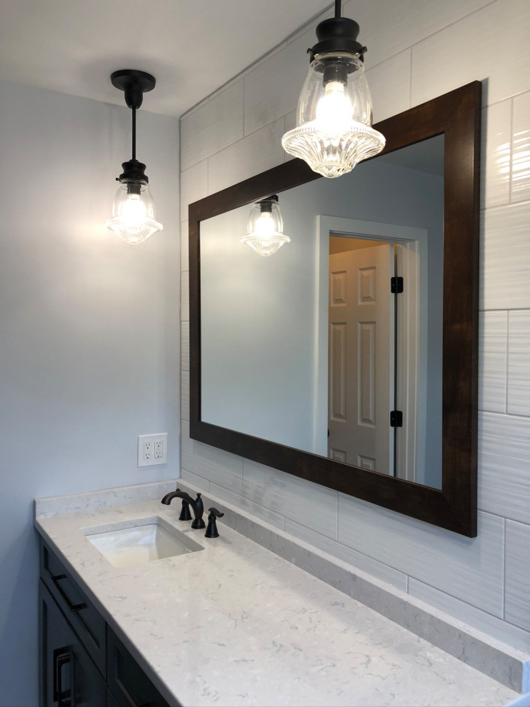 Example of a large mountain style master white tile and ceramic tile wood-look tile floor, brown floor and double-sink bathroom design in DC Metro with flat-panel cabinets, gray cabinets, an integrated sink, granite countertops, white countertops and a built-in vanity