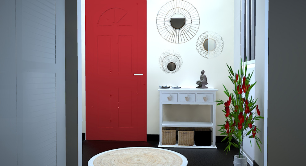 Bild på en liten tropisk foajé, med beige väggar, betonggolv, en enkeldörr, en röd dörr och svart golv
