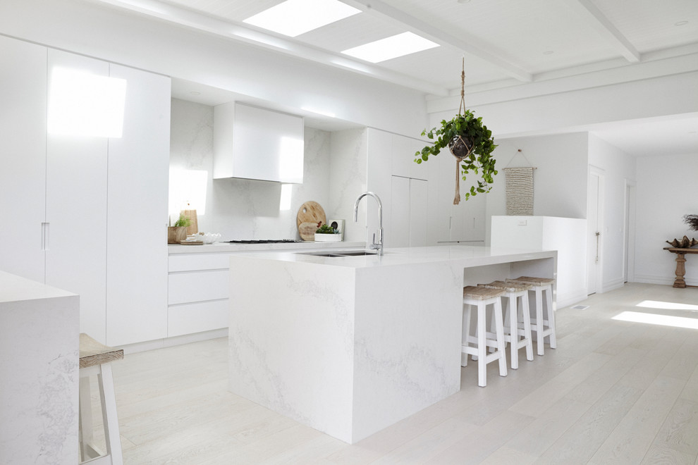 This is an example of a beach style kitchen in Sydney.