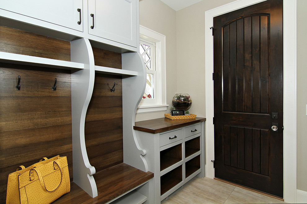Mudroom - transitional mudroom idea in Minneapolis with beige walls