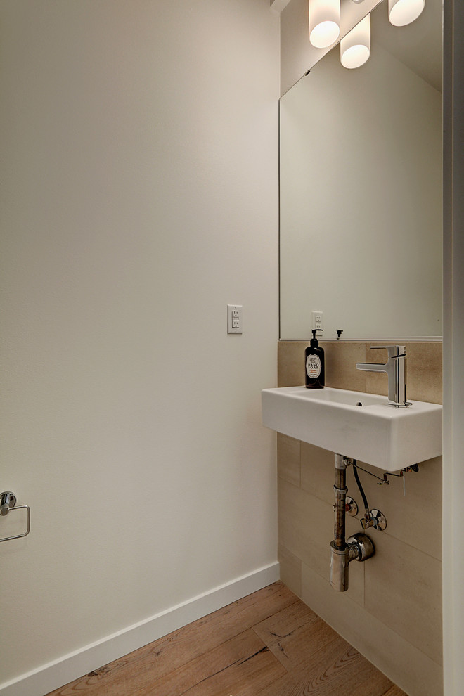 Photo of a modern powder room in Seattle with a pedestal sink.
