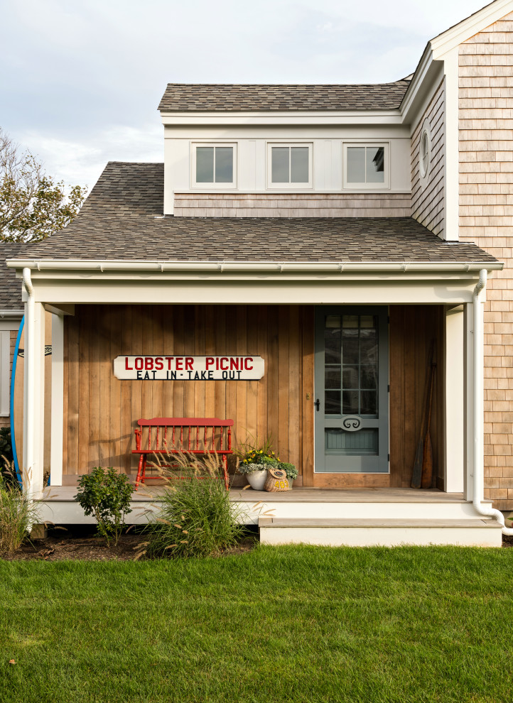 Beach style porch idea in Boston with decking and a roof extension