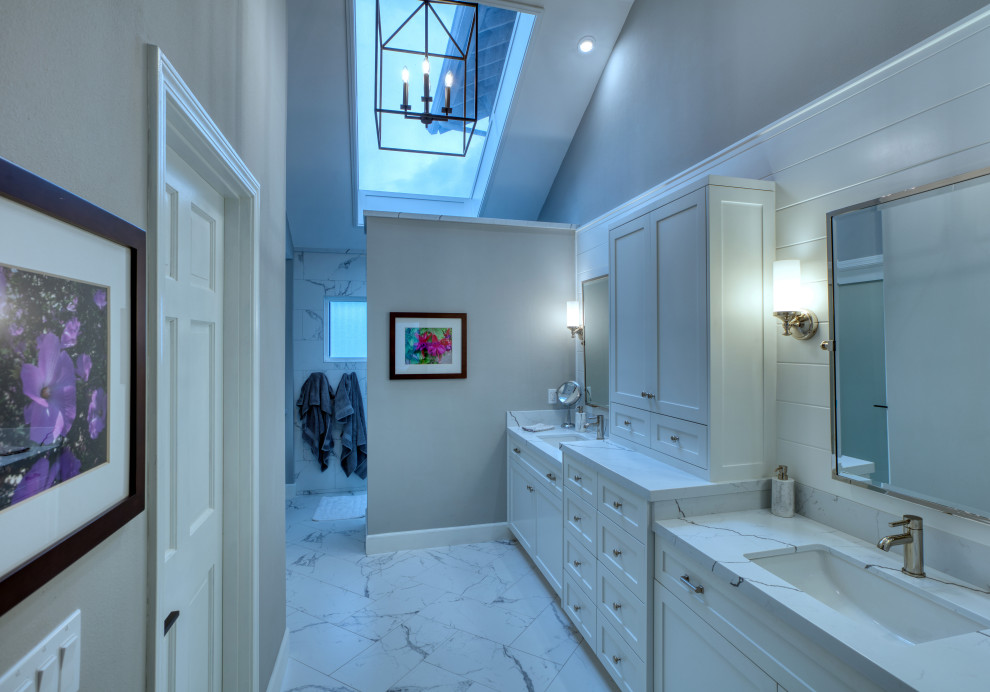 Large contemporary master bathroom in Los Angeles with shaker cabinets, white cabinets, an open shower, white tile, grey walls, an undermount sink, marble benchtops, an open shower, white benchtops, a double vanity, a built-in vanity and planked wall panelling.