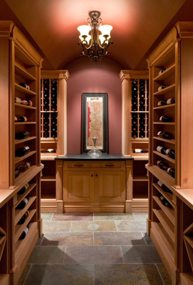 Design ideas for a large traditional wine cellar in Calgary with slate floors, display racks and grey floor.