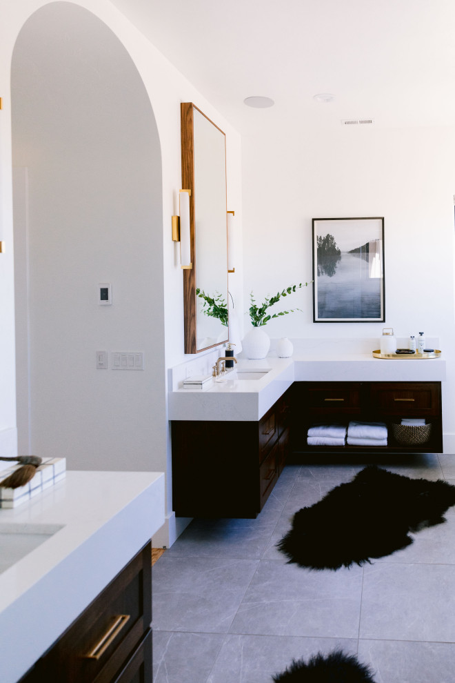 Inspiration for a large country master bathroom in Boise with shaker cabinets, dark wood cabinets, a freestanding tub, a corner shower, black tile, white walls, ceramic floors, an undermount sink, engineered quartz benchtops, grey floor, an open shower, white benchtops, an enclosed toilet, a double vanity and a built-in vanity.
