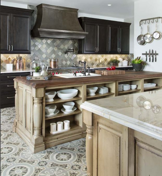 Design ideas for an expansive traditional galley kitchen pantry in Denver with a farmhouse sink, raised-panel cabinets, distressed cabinets, wood benchtops, multi-coloured splashback, glass sheet splashback, stainless steel appliances, cement tiles, multiple islands, multi-coloured floor and white benchtop.