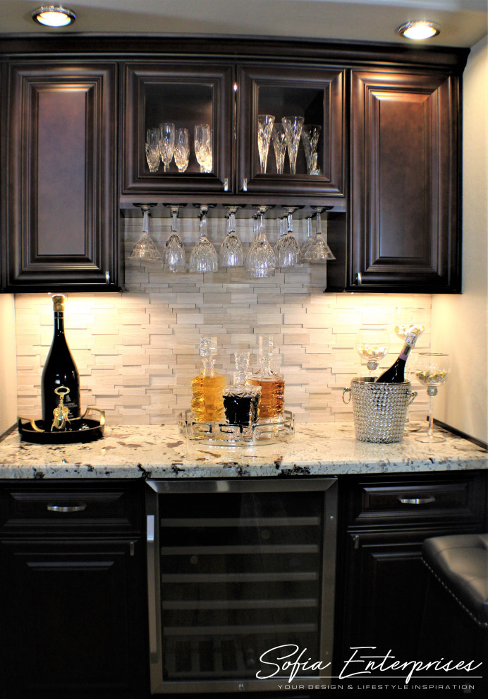 This is an example of a medium sized classic home bar in Phoenix.