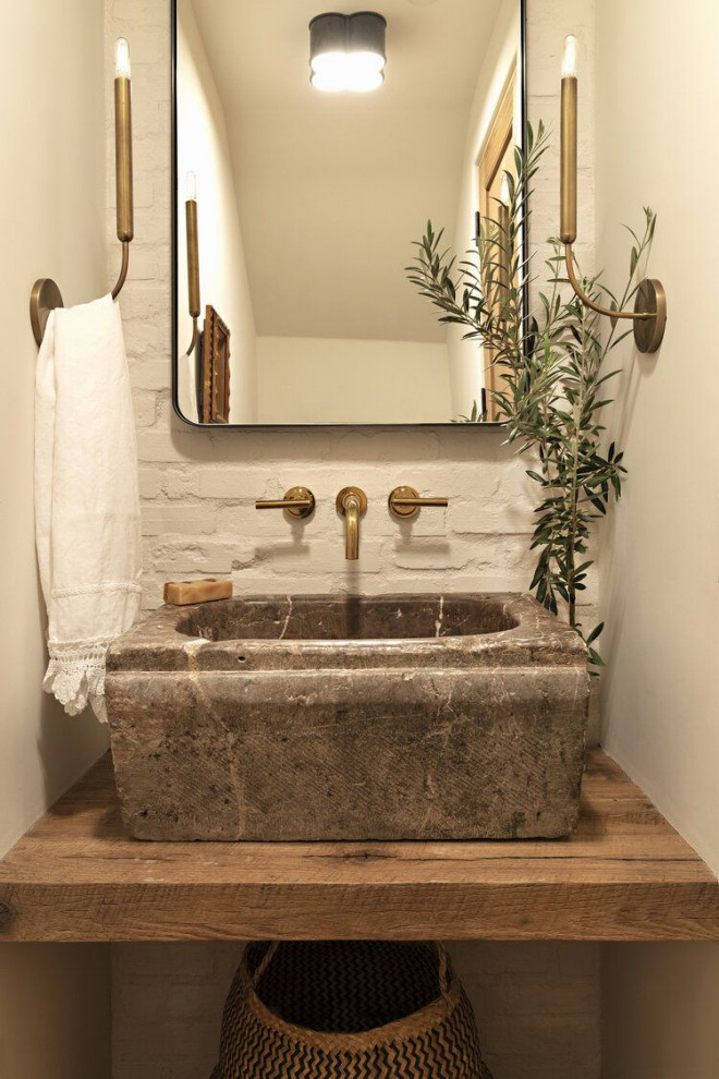 Inspiration for a mediterranean powder room remodel in Other