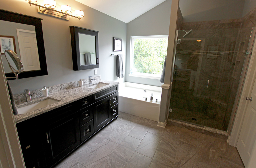 Mid-sized transitional master bathroom in Cleveland with flat-panel cabinets, black cabinets, a corner shower, green tile, porcelain tile, porcelain floors, an undermount sink, engineered quartz benchtops, grey floor and a hinged shower door.