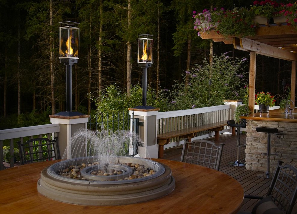 Transitional backyard deck photo in Seattle with a fire pit