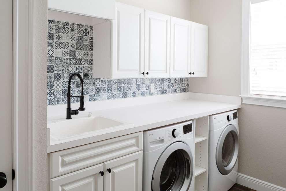 Inspiration for a country laundry room in Orlando with an utility sink, white cabinets, laminate benchtops, mosaic tile splashback, beige walls, a side-by-side washer and dryer and white benchtop.