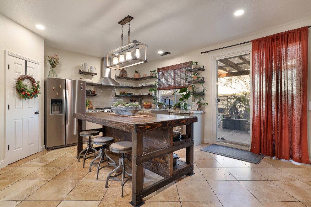 Eat-in kitchen - modern eat-in kitchen idea in Sacramento with a farmhouse sink, gray cabinets, granite countertops, gray backsplash, ceramic backsplash, stainless steel appliances, an island and multicolored countertops