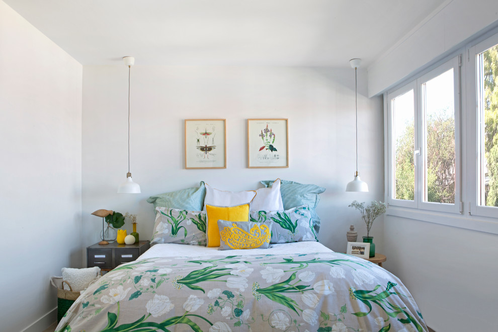 Inspiration for a tropical bedroom in Other with white walls.