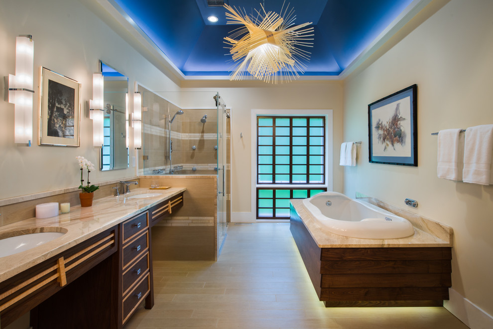 Inspiration for a large asian master bathroom in Philadelphia with an undermount sink, dark wood cabinets, a drop-in tub, beige tile, white tile, an alcove shower, ceramic tile, beige walls, ceramic floors, granite benchtops and flat-panel cabinets.